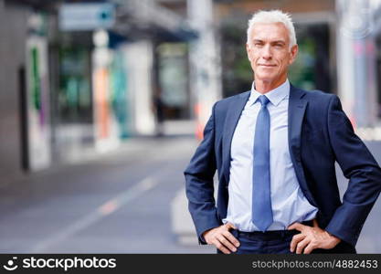 Portrait of confident businessman outdoors. Portrait of confident businessman in suit outdoors