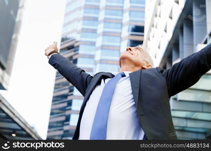 Portrait of confident businessman outdoors. Portrait of confident businessman in suit outdoors