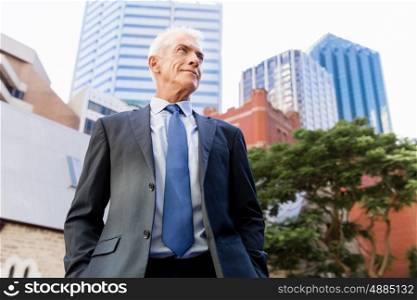 Portrait of confident businessman outdoors. Portrait of confident businessman in suit outdoors