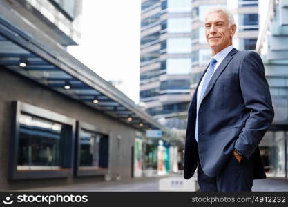 Portrait of confident businessman outdoors. Portrait of confident businessman in suit outdoors