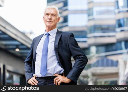 Portrait of confident businessman outdoors. Portrait of confident businessman in suit outdoors