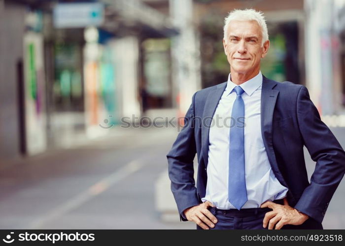 Portrait of confident businessman outdoors. Portrait of confident businessman in suit outdoors