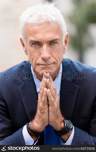 Portrait of confident businessman outdoors. Portrait of confident businessman in suit outdoors