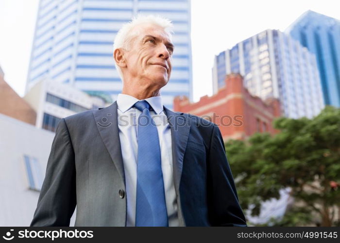 Portrait of confident businessman outdoors. Portrait of confident businessman in suit outdoors