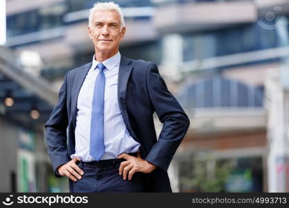 Portrait of confident businessman outdoors. Portrait of confident businessman in suit outdoors