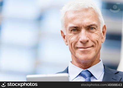 Portrait of confident businessman outdoors. Portrait of confident businessman in suit outdoors