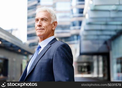 Portrait of confident businessman outdoors. Portrait of confident businessman in suit outdoors