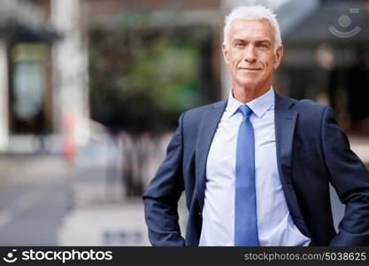 Portrait of confident businessman outdoors. Portrait of confident businessman in suit outdoors