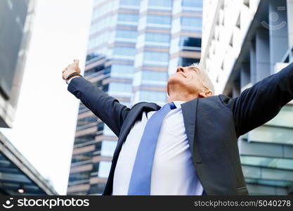 Portrait of confident businessman outdoors. Portrait of confident businessman in suit outdoors