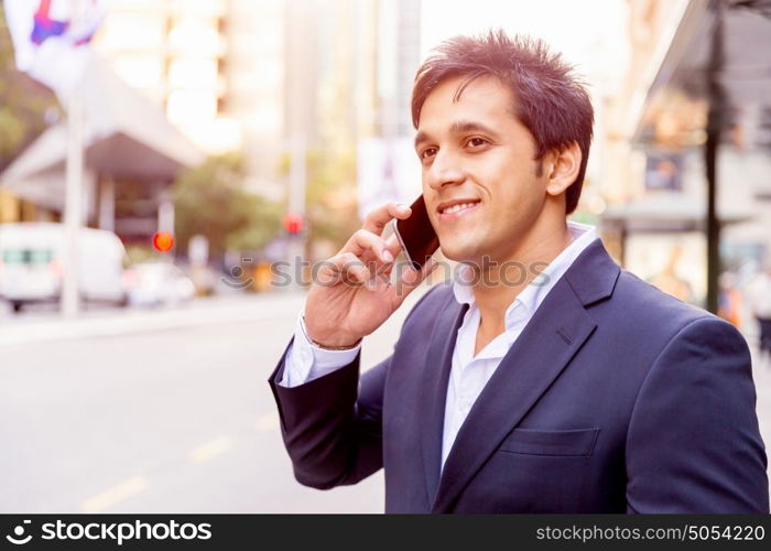 Portrait of confident businessman outdoors. Portrait of confident businessman with his mobile phone outdoors