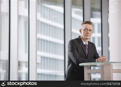 Portrait of confident businessman standing in office