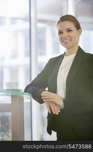 Portrait of confident businesswoman standing in office