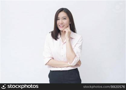 portrait of confident businesswoman wearing pink shirt isolated over white background studio