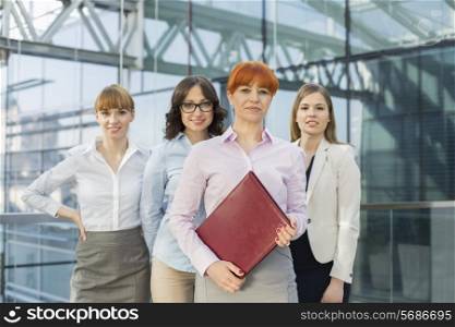 Portrait of confident businesswomen standing together in office