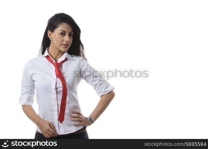 Portrait of confident fashionable businesswoman against white background