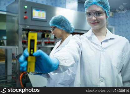 Portrait of confident female researcher carrying out scientific experiment in drink water laboratory