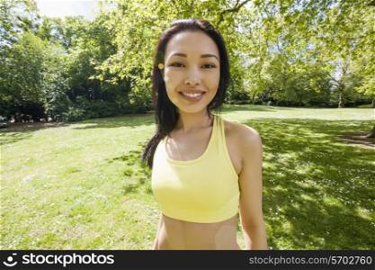 Portrait of confident fit woman at park