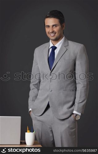 Portrait of confident Indian businessman standing in office