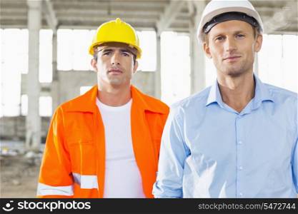Portrait of confident male architects at construction site