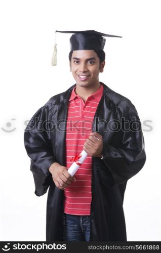 Portrait of confident male graduate student over white background