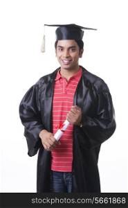 Portrait of confident male graduate student over white background