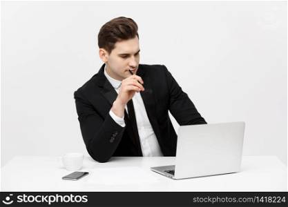 Portrait of confident manager sitting at desk. Portrait of business man working at computer. Successful formal man in his new modern office. Portrait of confident manager sitting at desk. Portrait of business man working at computer. Successful formal man in his new modern office.