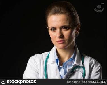 Portrait of confident medical doctor woman isolated on black