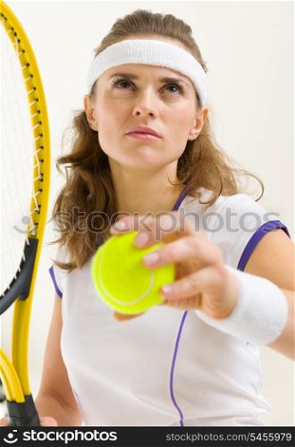 Portrait of confident tennis player ready to serve