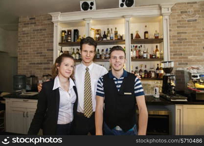 Portrait of confident waitstaff in restaurant