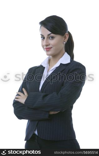 Portrait of confident well-dressed businesswoman with arms crossed over white background
