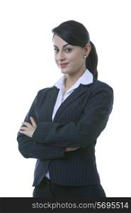 Portrait of confident well-dressed businesswoman with arms crossed over white background