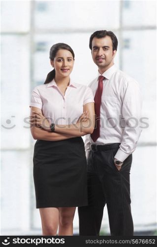 Portrait of confident young business colleagues in office
