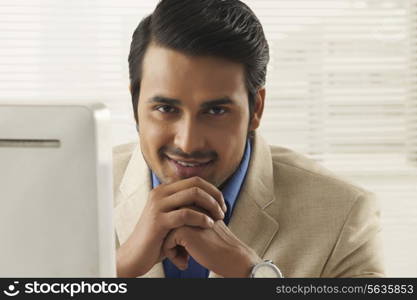 Portrait of confident young businessman in office