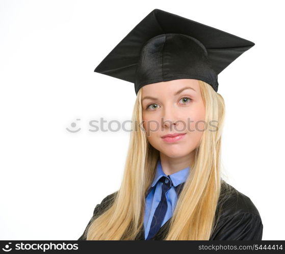 Portrait of confident young woman in graduation gown