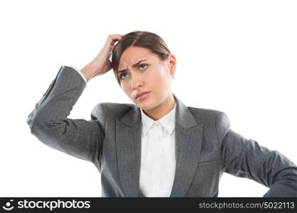Portrait of confused female executive thinking on white background