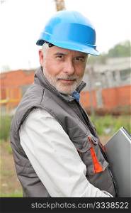 Portrait of construction manager on building site