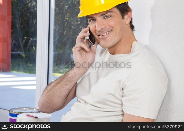 Portrait of construction worker talking on phone