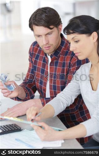 portrait of couple counting money