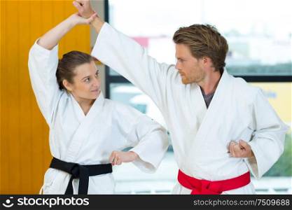portrait of couple doing karate