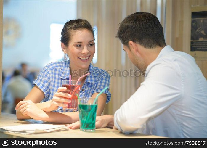 portrait of couple drinking beverage