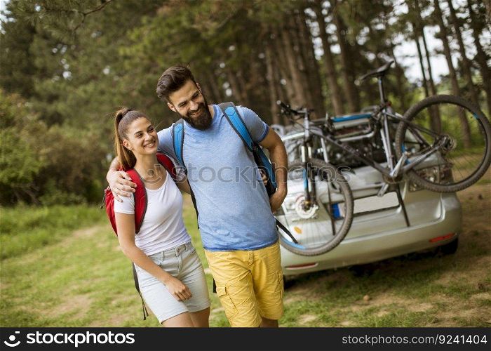 Portrait of couple hugging and walking  in nature