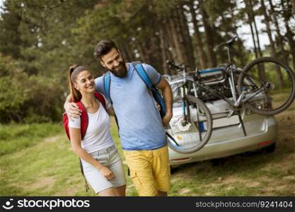 Portrait of couple hugging and walking  in nature