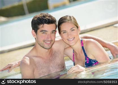 Portrait of couple in a pool