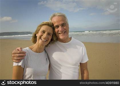 Portrait of couple smiling on a beach