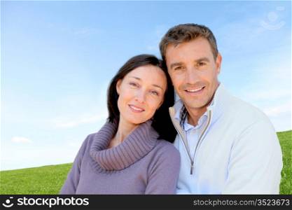 Portrait of couple standing outside