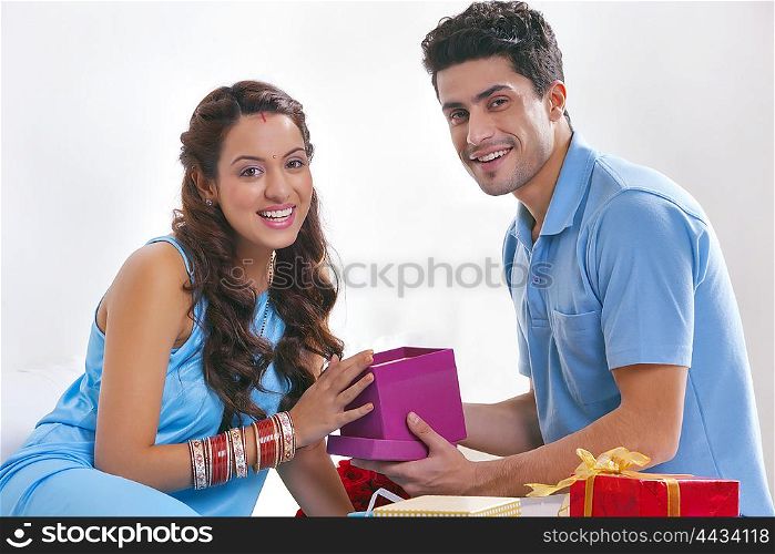 Portrait of couple with gift boxes