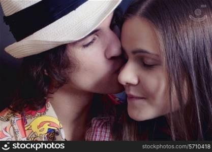 Portrait of Couple young lovers kissing teen closeup