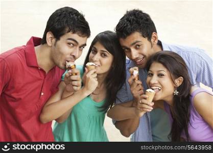Portrait of couples eating ice cream