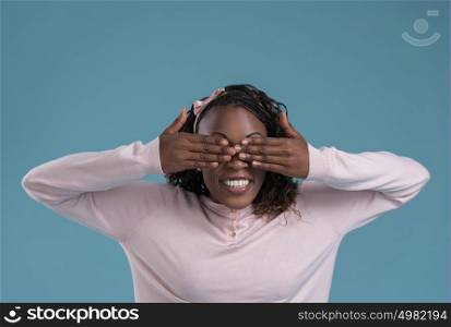 Portrait of cute african woman posing - hiding eyes with hands