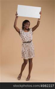 Portrait of cute african woman posing - holding blank copyspace sign